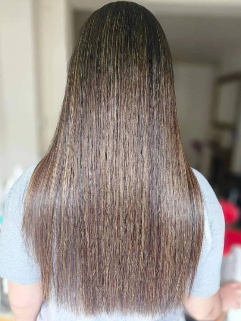 Long straight brown hair with fine caramel highlights